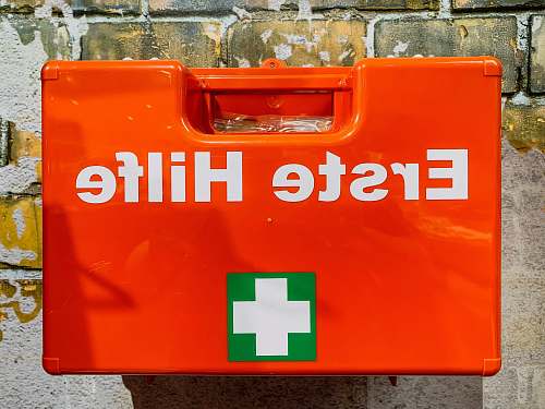 first aid red box close-up photography orange
